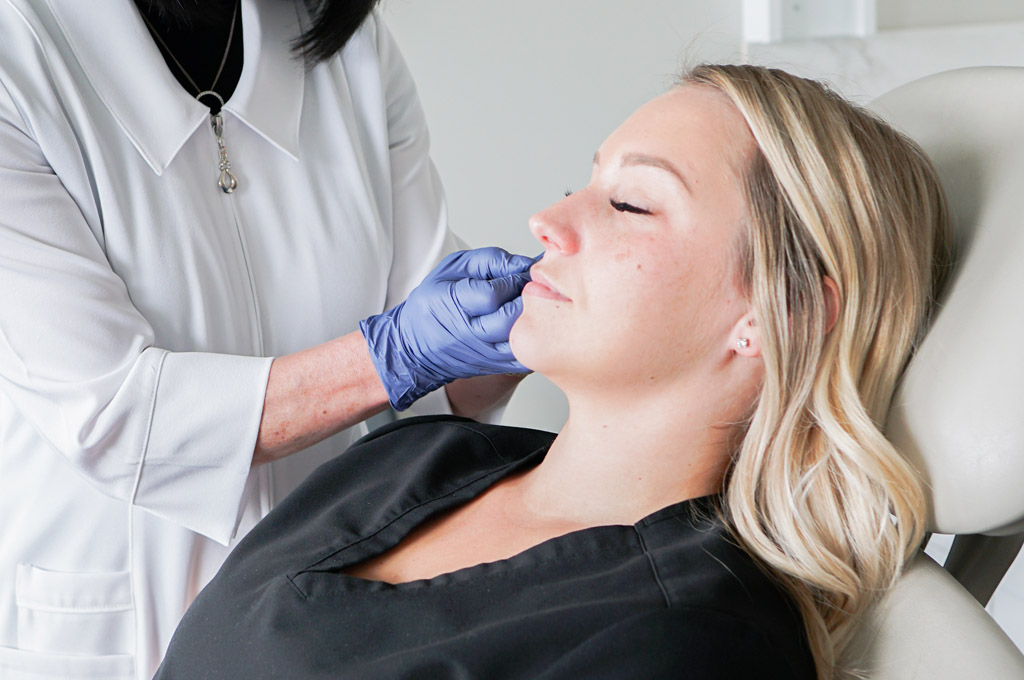 Blonde woman having Botox injections